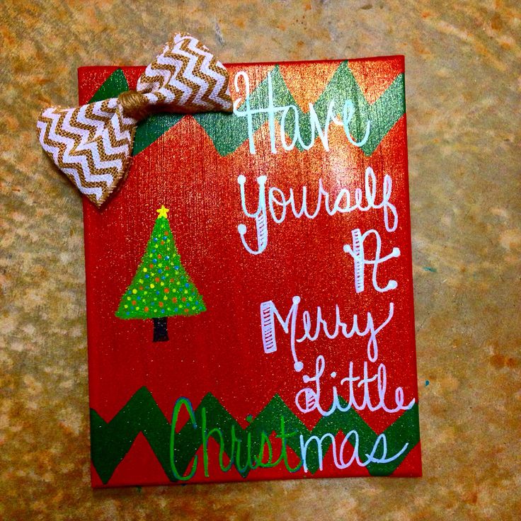 there is a christmas card with a bow on the top and words written in white