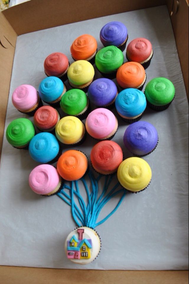 cupcakes are arranged in the shape of a tree