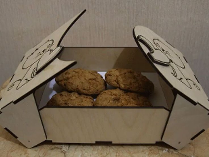 some cookies in a cardboard box on a table