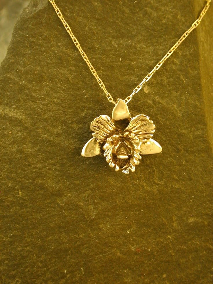 "This solid 3 Dimensional Original Catalaya Orchid is 14K Gold The included chain is a 14K Gold chain. You may chose 16, 18 or 20 inch at the same price. Other length available at sightly higher prices. The Orchid pendant measures 3/4\" tall by 7/8\" across. I hand cast all my pieces using the lost wax casting method.  Please ask your needs. You may call me with questions, often I am out so please use my machine. 831-476-3176. Satisfaction Guaranteed! I send items USPS First Class unless otherwi Unique Gold Necklace, Orchid Pendant, Orchid Necklace, Orchid Jewelry, Cartier Gold, Gold Orchid, The Orchid, Dope Jewelry, Wax Casting