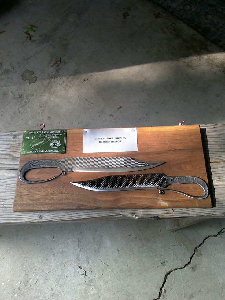 a knife on display in a wooden case