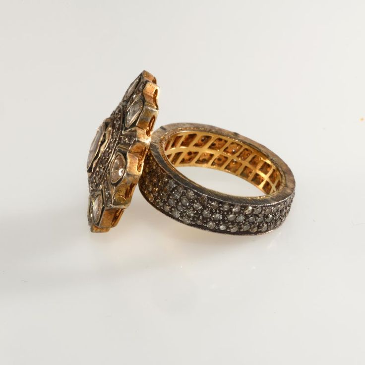 This is part of Chairish’s Fine Jewelry assortment.  Antique-look ring in a Georgian revival style. Crafted of gold plated sterling silver embellished with genuine diamonds. The larger diamonds on the top are rose cut while the pave' set accent stones are faceted. The pave' stones encircle the entire band. We believe this ring dates to c. 2000. It was purchased by the original owner in New York at the time Barney's was selling this style of ring for more than twice the price. Unmarked. Fits a si Luxury Yellow Gold Cluster Ring With Rose Cut Diamonds, Luxury Gold Cluster Ring With Rose Cut Diamonds, Luxury Gold Diamond Ring With Rose Cut Diamonds, Luxury Gold Diamond Ring With Rose Cut, Luxury Oval Cluster Ring With Single Cut Diamonds, Luxury Open Diamond Ring With Rose Cut Diamonds, Heirloom Diamond Ring For Ceremonial Occasions, Luxury Jewelry With Rose Cut Diamonds In Diamond White, Luxury Dome Ring With 17 Jewels For Anniversary