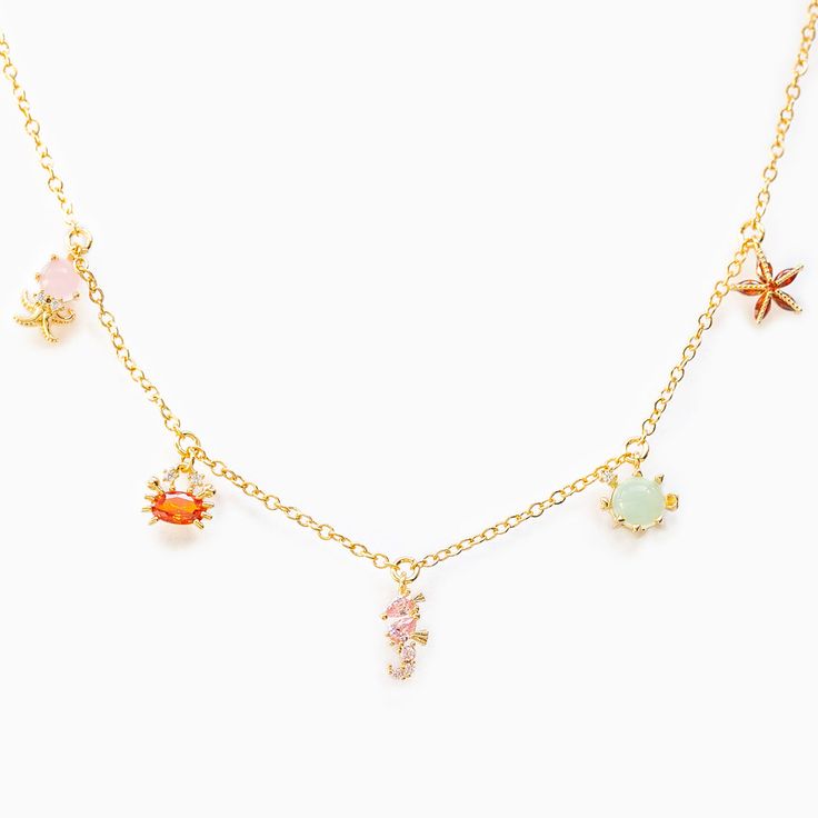 Take a plunge into the ocean in this sea-inspired necklace! 18k gold plated, 18k rose gold plated, or rhodium plated over brass with a protective coating Cubic zirconia stones 13" chain with a 2" extension Shop our entire Under the Sea Collection here! Sale items are final sale. Sea Necklace, Preppy Jewelry, Ocean Necklace, Gloss Labial, Beach Necklaces, Jewelry Accessories Ideas, Jewelry Essentials, Jewelry Lookbook, Pet Necklace