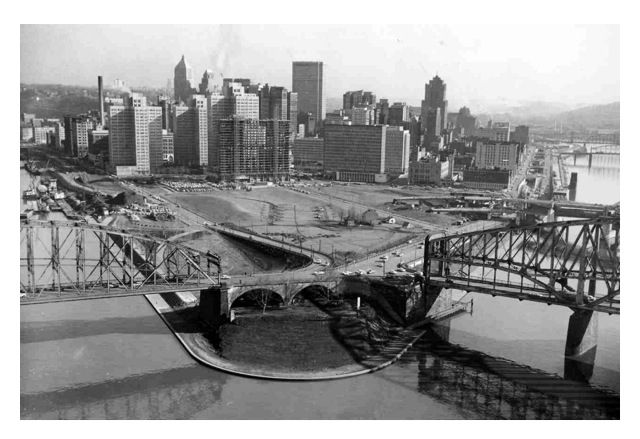 an aerial view of the city and bridge