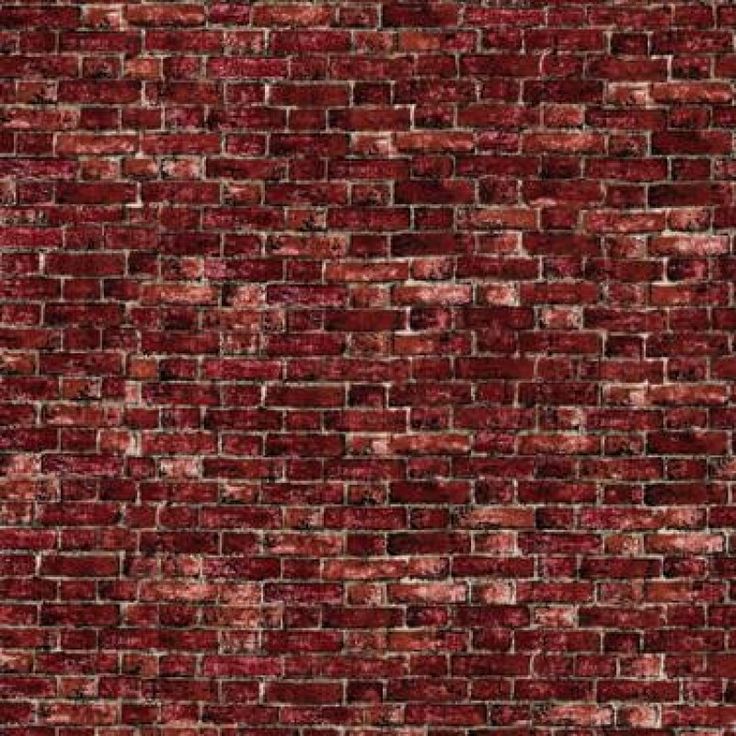 a brick wall with red paint on it