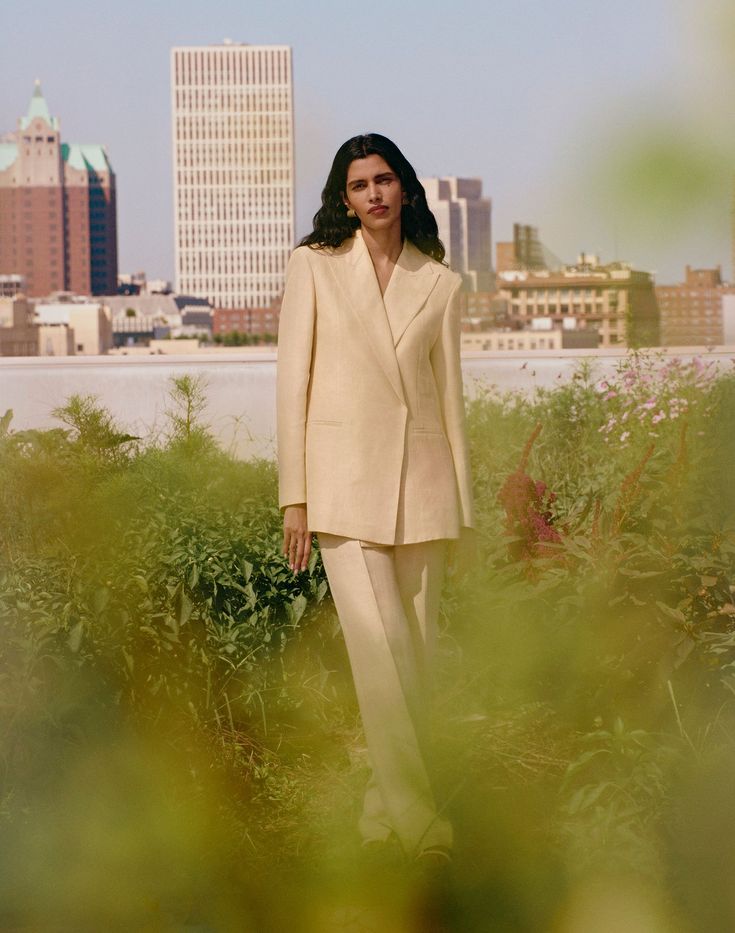 Tailored Linen Pantsuit For Spring, Spring Pantsuit With Pressed Crease Trousers, Spring Linen Pantsuit With Notch Lapel, Spring Pants With Pressed Crease And Straight Hem, Tailored Straight Leg Spring Pantsuit, Tailored Straight Leg Pantsuit For Spring, Spring High-waisted Pantsuit With Welt Pockets, Tailored Tapered Leg Spring Suits, Tailored Tapered Leg Suits For Spring