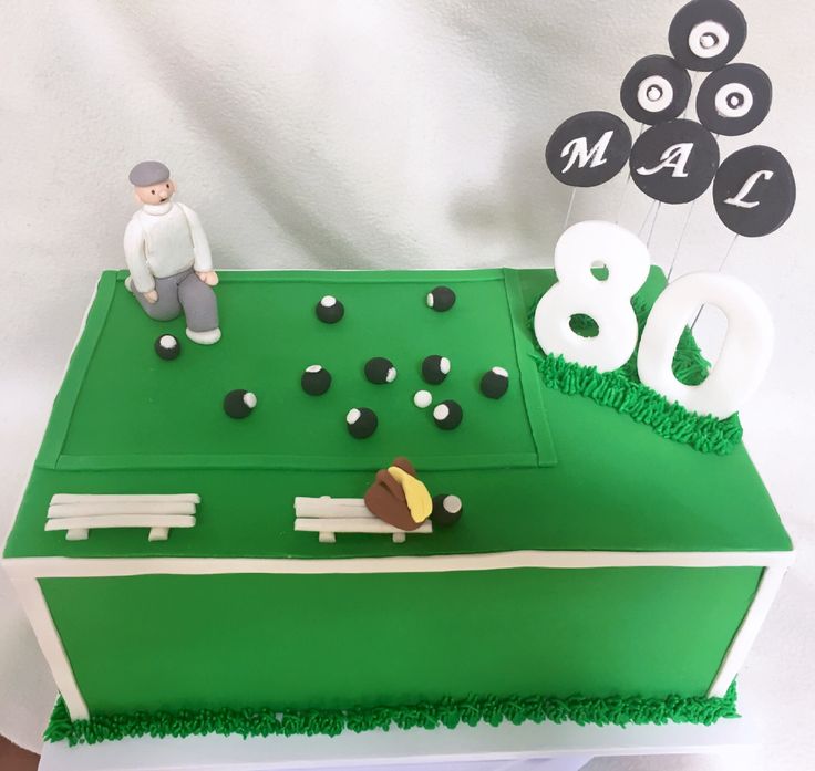 a cake that is shaped like a golf course and has the number 80 on it