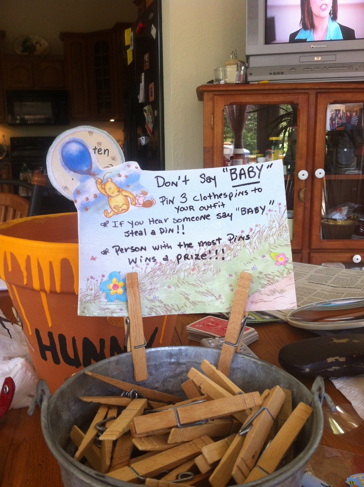 a bowl full of sticks with a sign on it that says don't sit baby