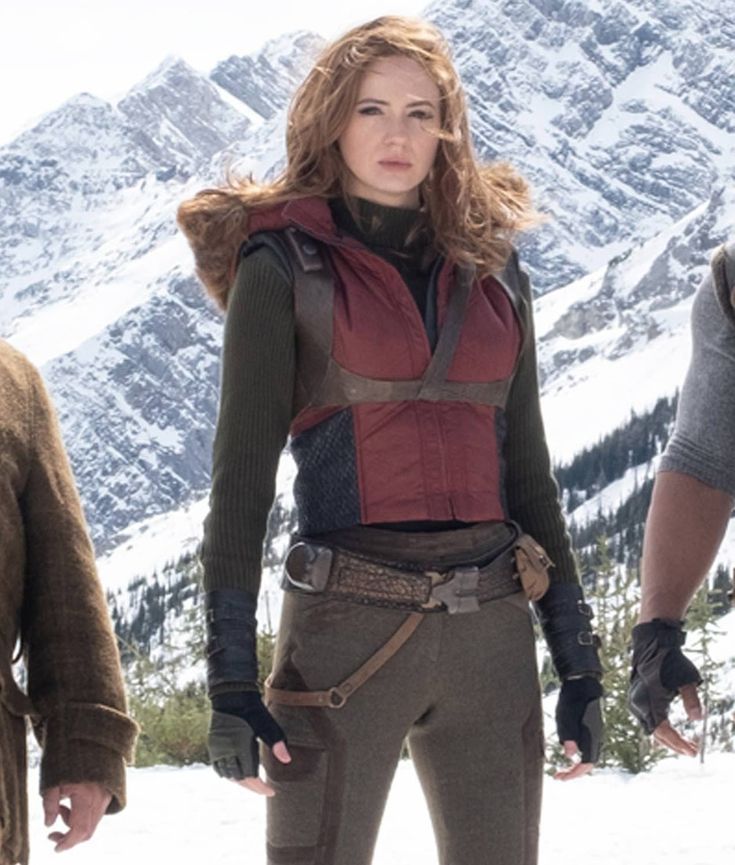 the cast of x - men days of future past standing in front of snow covered mountains