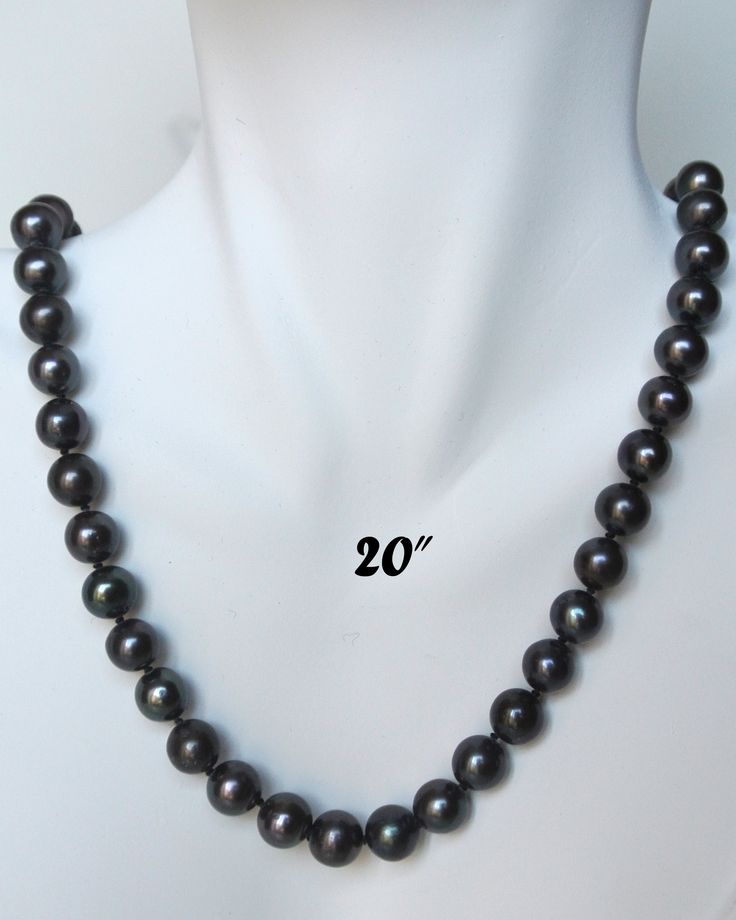 "PREMIUM ROUND 9-9.5mm BLACK PEARL NECKLACE Elegant Round shaped black cultured freshwater pearl necklace; Handpicked by experienced jewelers for their luster, color and cleanliness; Available in other pearl sizes (6mm to 12mm) and other colors (white, peach). EXQUISITE CRAFTSMANSHIP Carefully double knotted between each pearl; Finished with sturdy rose-shaped clasps; This fine pearl jewelry is a symbol of wisdom and is believed to offer protection and attracts good luck and wealth. LUXURY JEWEL Tahitian Pearl Necklaces For Anniversary, Classic Tahitian Pearl Jewelry With Round Beads, Single Strand Tahitian Pearl Jewelry With Round Beads, Tahitian Pearl Round Jewelry For Anniversary, Tahitian Pearl Jewelry For Anniversary, Classic Tahitian Pearl Necklace For Anniversary, Black Pearl Necklace With High Luster For Gift, Classic Jewelry With 8mm Round Beads, Silver Tahitian Pearl Round Jewelry