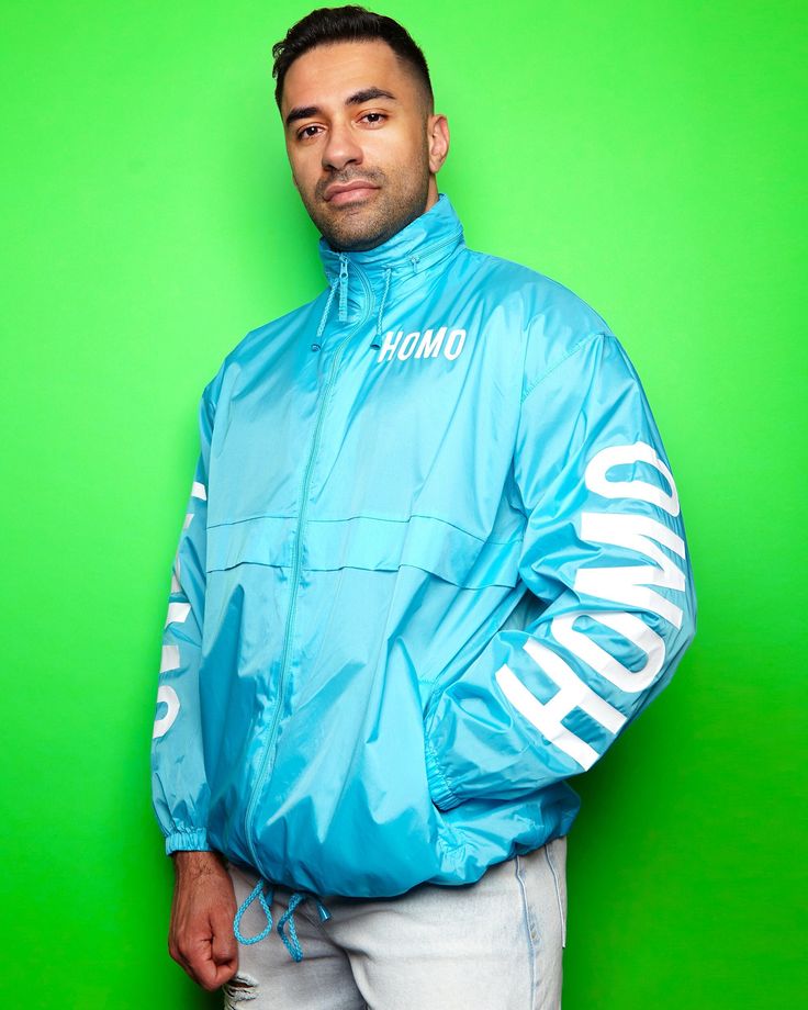 Light weight blue jacket, perfect for rainy festivals and prides. Throw it in a backpack when your party and you're ready for any weather fail and still look hot af while you do. Can be folded into the right pocket to create a small easy carry bag. Shower resistant and windproof with a concealed hood found inside the collar. SIZE GUIDE: We recommend that customers buy the size they have mainly in their wardrobe. As the bases are not big or small compared to other brands. (Not including active we Blue Hooded Windbreaker For Streetwear, Urban Style Blue Windbreaker For Outdoor Activities, Blue Waterproof Outerwear For Streetwear, Blue Waterproof Streetwear Outerwear, Blue Waterproof Windbreaker For Streetwear, Casual Blue Waterproof Windbreaker, Blue Nylon Windbreaker For Streetwear, Blue Nylon Long Sleeve Raincoat, Trendy Blue Windbreaker With Pockets