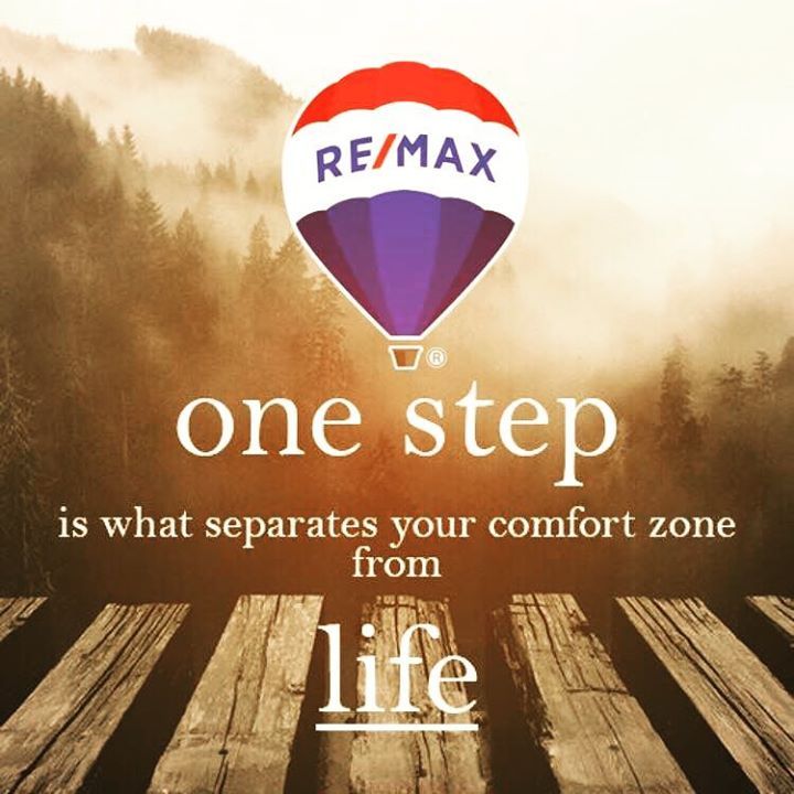 an advertisement for re / max with a hot air balloon in the sky above it