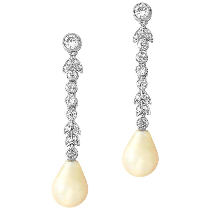 A pair of Edwardian pearl and diamond drop earrings, the natural saltwater drop shape pearls measuring approximately 11 x 8.3mm and weighing 4.28 and 4.73 carats, accompanied by a Gem & Pearl Laboratory certificate, suspended from an old- and rose-cut diamond-set foliate run, the diamonds all millegrain rubover-set in white, with screw fittings, circa 1910, the earrings measuring approximately 4 x 0.8cm, gross weight 5.49 grams. A Pair of Edwardian earrings in Good condition. Unmarked, metal tes Pear-shaped Pearl Drop Bridal Earrings In White Gold, Luxury Pear-shaped Pearl Drop Diamond Earrings, Luxury Drop Pearl Earrings, Formal Pear-shaped Diamond Pearl Earrings, Formal Pear Shaped Diamond Pearl Earrings, Pear-shaped Diamond Earrings For Evening, Fine Jewelry Pearl Drop Dangle Diamond Earrings, Teardrop Diamond Pearl Earrings For Evening, Pear-shaped Pearl Drop Diamond Earrings