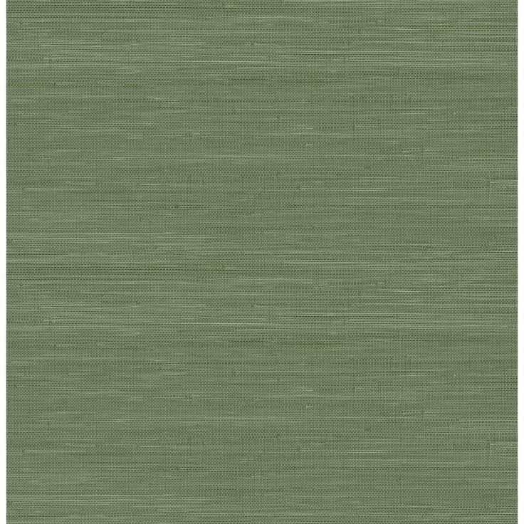 an area rug with green grasscloth