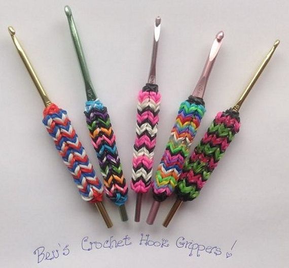 four crochet hooks in different colors and sizes