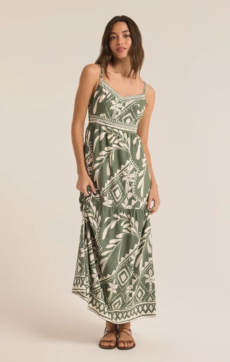 Feel effortlessly pretty all day in this maxi dress, featuring a fitted bodice and a full, tiered skirt with delicate shirring for added volume. Made from lightweight rayon linen fabric, it boasts a sweetheart neckline and adjustable spaghetti straps, making it an ideal choice for any occasion. Regular fit Rayon Linen: 85% Viscose, 15% Linen Lining: 100% Rayon Sweetheart neck Sleeveless Midi length Adjustable spaghetti strap Lightweight Heavy soft wash Machine Wash Cold, Gentle Cycle, Lay Flat t Tiered Sundress With Adjustable Straps For Garden Party, Summer Tiered Maxi Dress In Rayon, Summer Rayon Tiered Maxi Dress, Casual Tiered Beach Dress With Adjustable Straps, Tiered Maxi Dress With Adjustable Straps For Summer, Casual Maxi Dress With Adjustable Straps For Brunch, Beach Tiered Skirt Maxi Dress In Rayon, Bohemian Tiered Maxi Dress With Tie Straps, Casual Spaghetti Straps Tiered Dress For Vacation