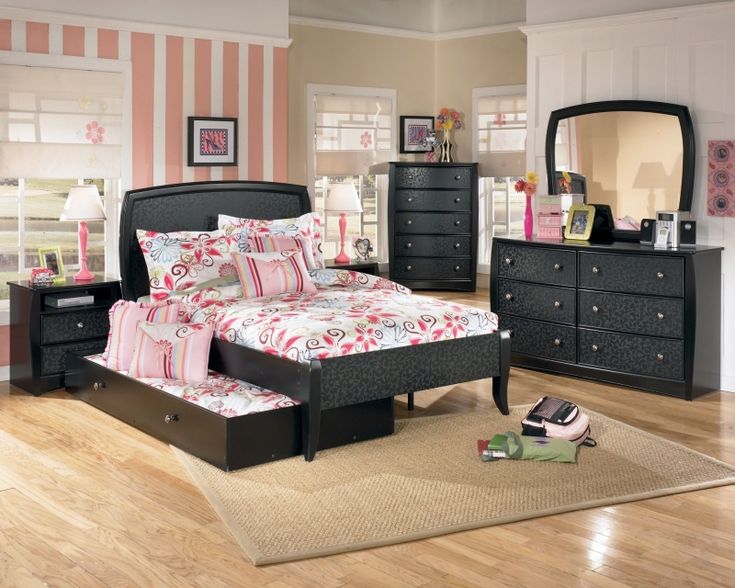 a bedroom scene with focus on the bed and dresser