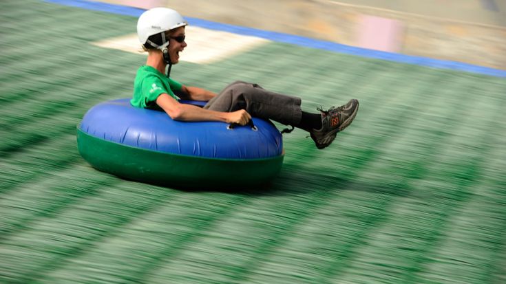 a man is sitting on an inflatable tube