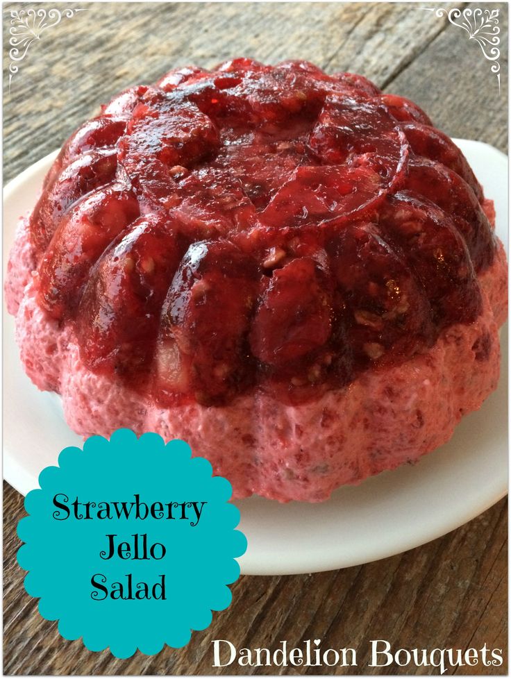 a strawberry jello salad on a plate with the words, strawberries jello salad