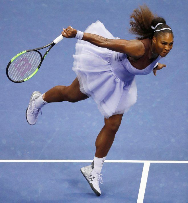 a female tennis player in action on the court