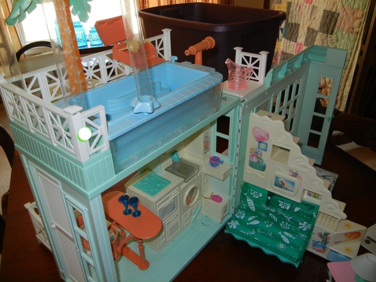 a doll house with furniture and accessories on the floor