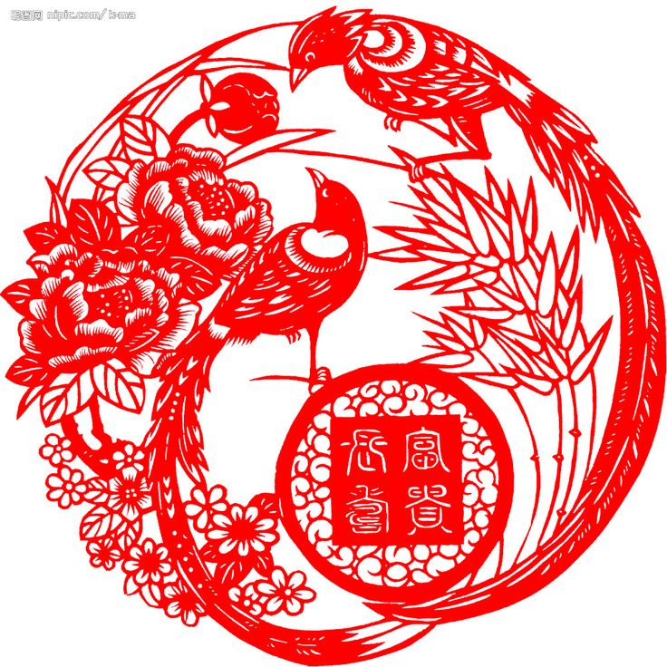 a red paper cut design with birds and flowers