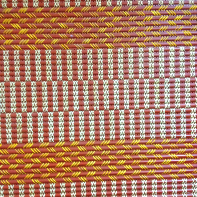 red and yellow woven material with white stripes