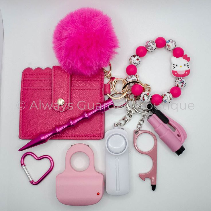 Elevate your safety and style with our Hello Kitty Special Full Guarded Safety Keychain. Crafted for the fashion-forward and security-conscious, this keychain features a vibrant hot pink and Hello Kitty print silicone bead wristlet adorned with a charming Hello Kitty Charm. Stay organized on the go with the hot pink card holder wallet, ensuring your essential cards are always within reach. Enhance your personal safety arsenal with the included hot pink kubaton and white premium alarm equipped wi Cheap Pink Keychains With Key Clip, Pink Keychain With Key Clip For Everyday Use, Trendy Pink Keychain For Everyday Use, Personal Safety, Carabiner Clip, Mini Hands, Pink Cards, The Embrace, Pink Mini