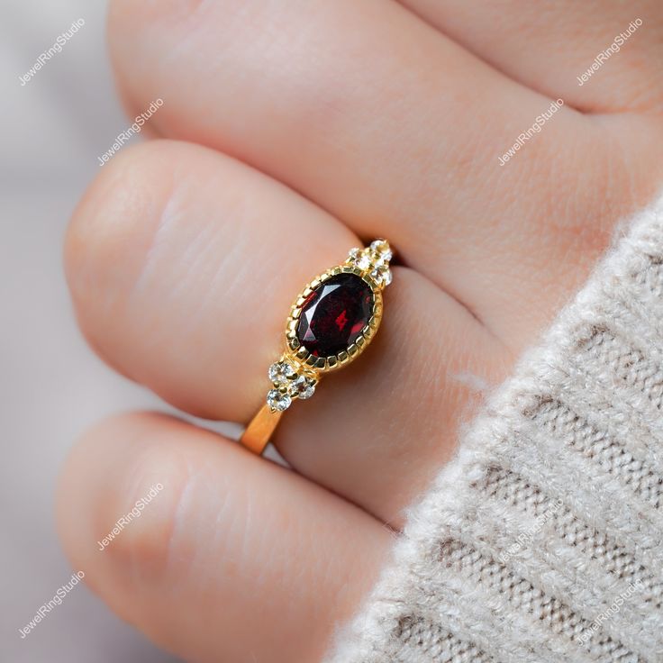 Gemstone : Natural Red Garnet  Metal : 9K Gold / 14K Gold / 18K Gold / 925S Silver Gemstone Shape and Size : Oval 8x6 MM Gemstone Shape and Size : Round 1.50 MM Gemstone Weight : 1.30 Cts Metal Weight :  3.00 Gram ACCEPT CUSTOM SERVICE: 1. Accept change main stone type, size : Oval  8x6 MM 2. Accept change other material : This jewelry can also be made in solid gold (14K white/rose/yellow gold...) Please contact me if you have special requests. Thanks for your visiting! Gold Garnet Cluster Promise Ring, Yellow Gold Garnet Cluster Ring As Gift, Gold Garnet Birthstone Ring With Center Stone, Yellow Gold Garnet Rings For Anniversary, Gold Garnet Birthstone Ring, Garnet Diamond Promise Ring In Yellow Gold, Yellow Gold Garnet Diamond Promise Ring, Garnet Birthstone Cluster Ring, Heirloom Garnet Birthstone Ring For Promise