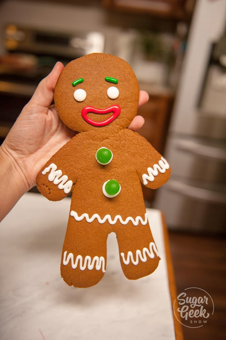 a person holding up a ginger with green eyes