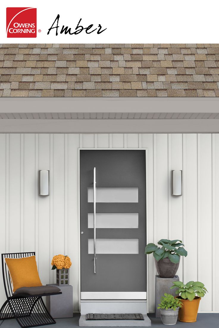 an image of a front porch with chairs and potted plants