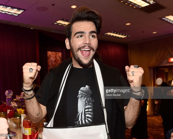 a man wearing an apron and holding up his fists