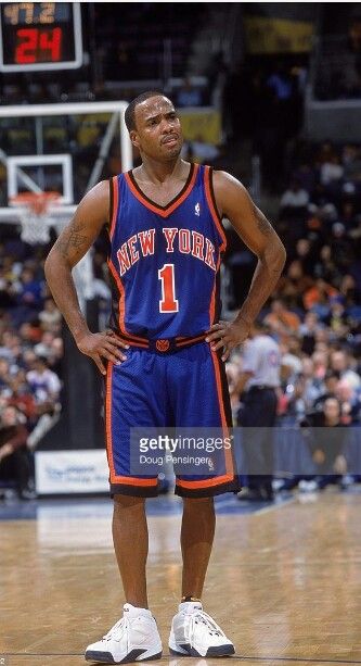 an image of a basketball player standing on the court