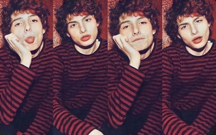 four photos of a young man with curly hair and striped sweaters, making an odd face