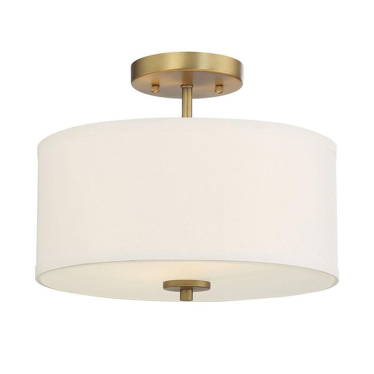 a semi - flush ceiling light with a white shade on the bottom and gold trim