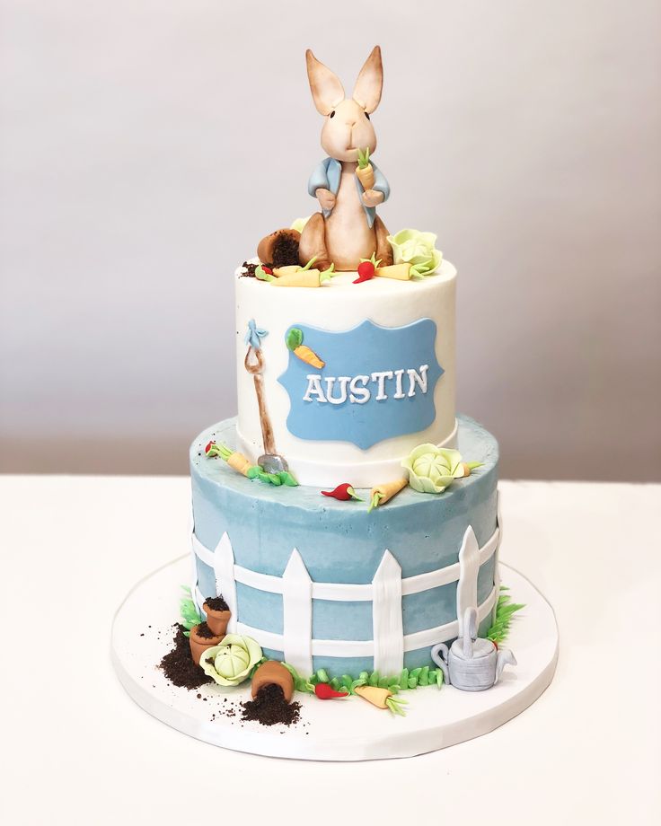 a birthday cake decorated with an image of a bunny on top