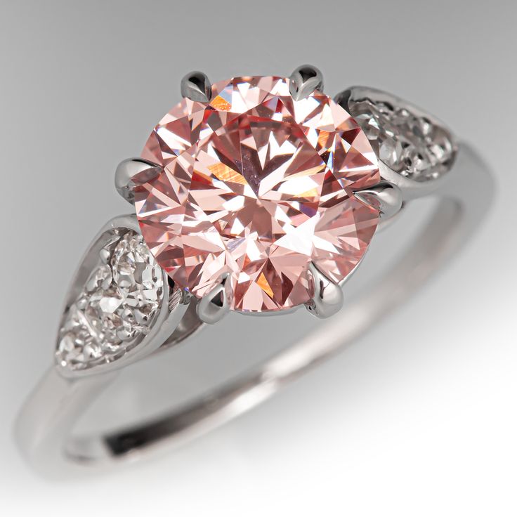 This fabulous vintage French solitaire ring is crafted of 18k white gold and now holds a 2.28ct lab grown diamond that is IGI certified and grades fancy vivid pink in color and VS2 in clarity. The ring is currently a size 6.25. EraGem lab diamond rings will arrive with an in-store certification as well as the IGI report and a lovely EraGem logo presentation box. Classic Pink Gia Certified Diamond Ring, Fine Jewelry Pink Diamond Ring In Platinum, Formal Pink Diamond Ring In Platinum, Pink Round Diamond Ring, Fine Jewelry, Elegant Pink Diamond Ring In Platinum, Pink Round Cut Diamond Ring, Fine Jewelry Pink Round Cut Diamond Ring, Pink 14k White Gold Jewelry With Center Stone, Pink Platinum Diamond Ring For Anniversary