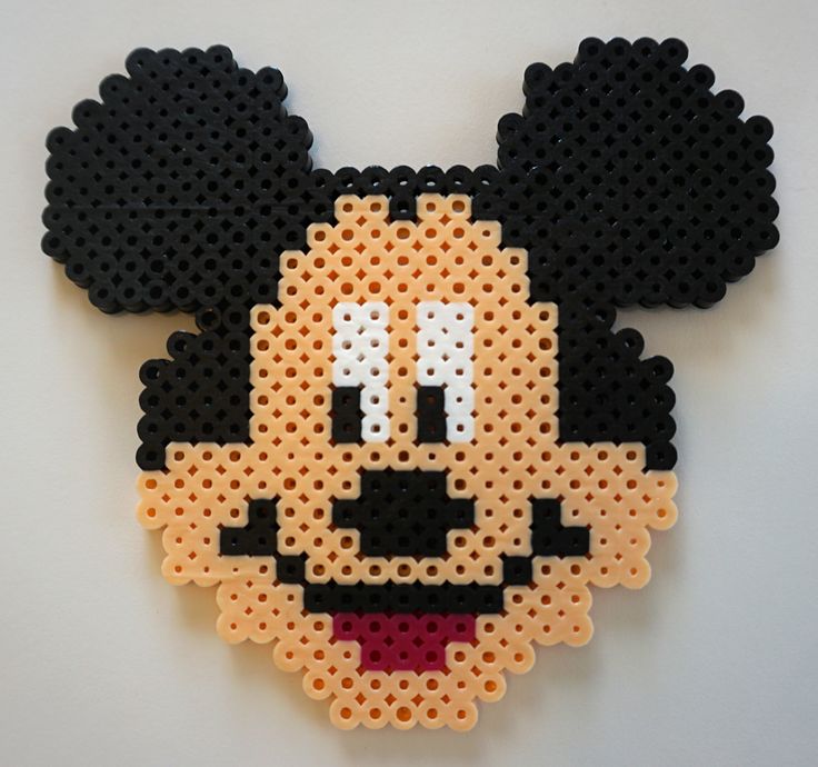 a close up of a mickey mouse made out of perler beads