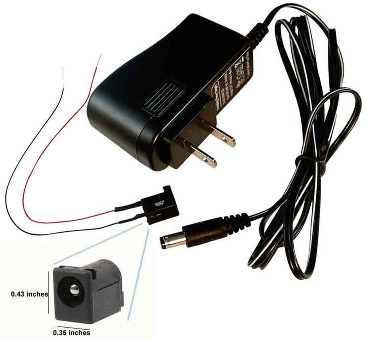 an ac power adapter plugged into a wall charger with two wires connected to it