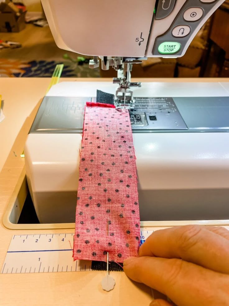 someone is using a sewing machine to sew something