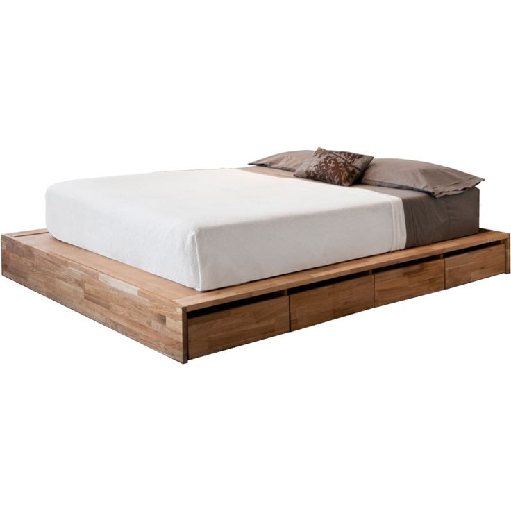 a bed with two drawers underneath it and a pillow on the top of each drawer