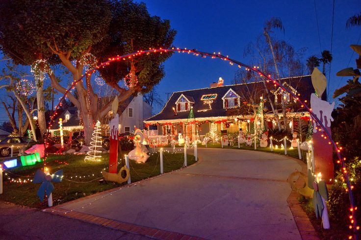 a house decorated with christmas lights and decorations