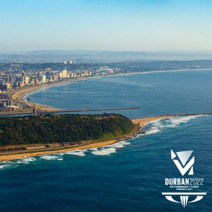 an aerial view of the ocean and city