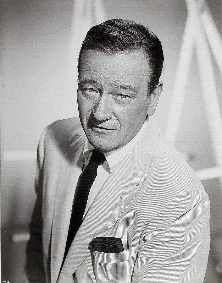 an old black and white photo of a man in a suit