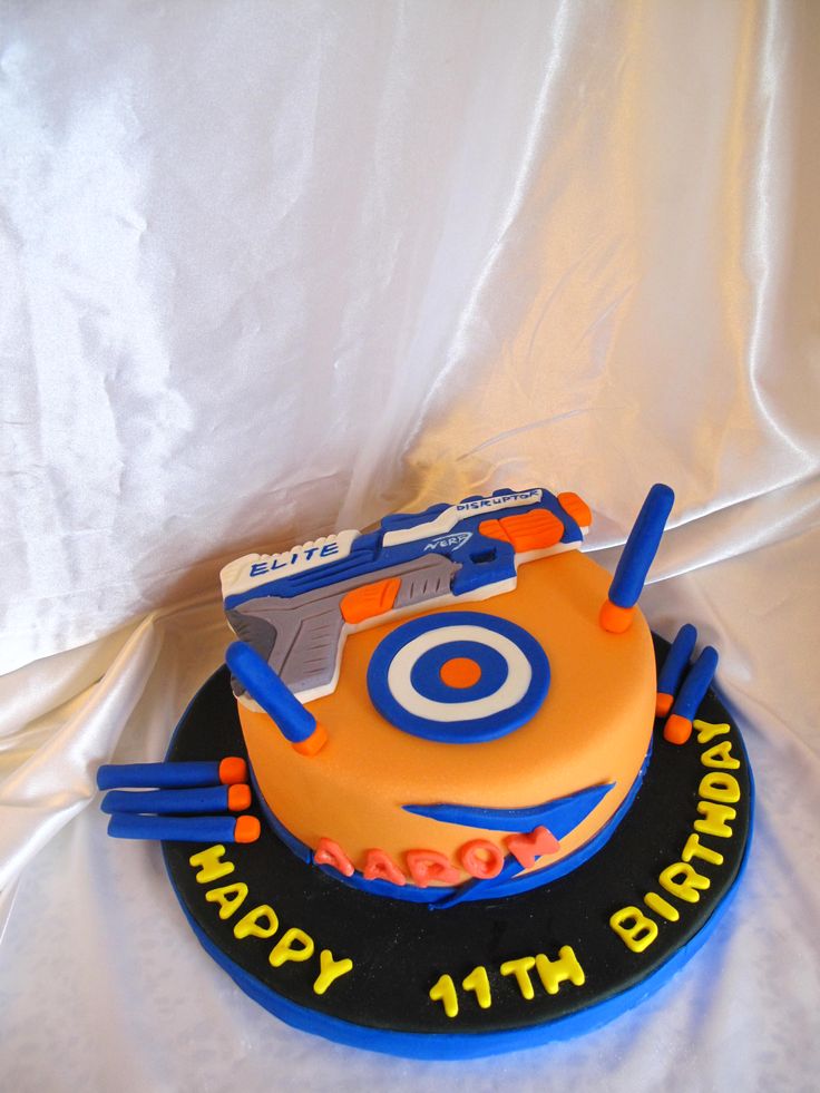 a birthday cake with an orange and blue theme