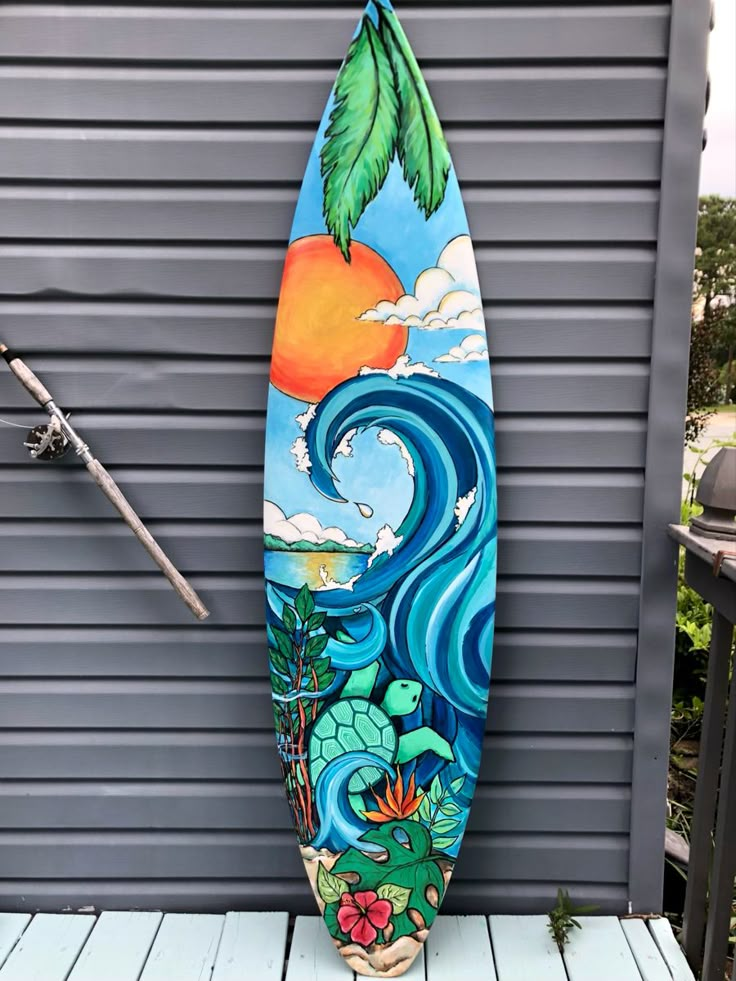 a surfboard is sitting on a wooden deck