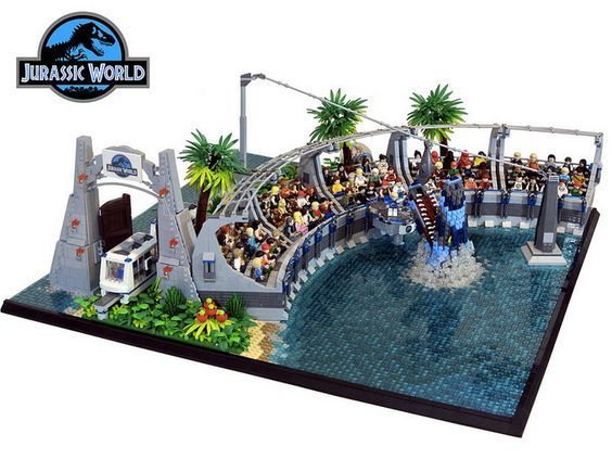 a lego model of an amusement park with people riding on the rides and water slides