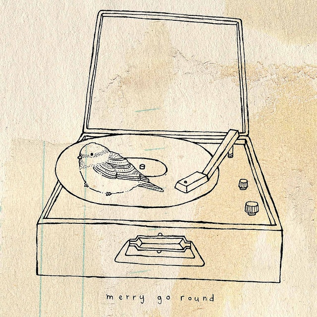 a drawing of a record player with the words merry go round on it's side