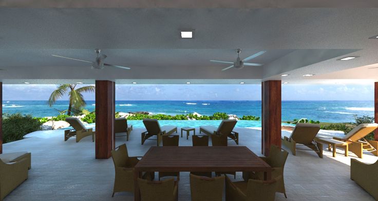 an outdoor dining area overlooking the ocean