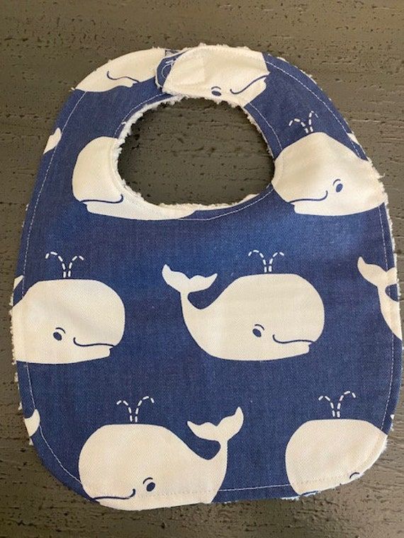 One handmade baby bib made from cotton fabric. Bib is backed with white chenille. The closer is made of a strong Velcro.  Other nautical bibs listed. Measurements:  8.5in wide and from top of bib to bottom 11.5in.  Neck opening measures 11in to 11.5 in around. I seek for 100% customer satisfaction so please reach out with questions, I'm happy to help. Thank you for visiting the store and please return as more things are listed regularly. Cotton Playtime Bib For Babies, Playful Cotton Bib, Machine Washable, Playful Cotton Bib Machine Washable, White Reusable Bib For Playtime, Cute Handmade Cotton Bib, Playful White Machine Washable Bib, Playful White Cotton Bib, Cute White Bib For Playtime, Cute Handmade White Bib